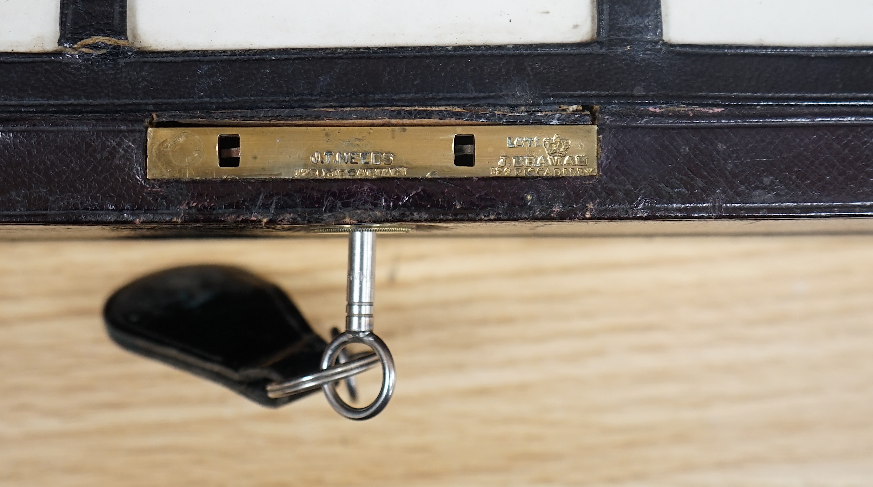 J.T. Needs, 128 Piccadilly, London, a travelling writing slope with Bramah Lock & Keys, 31cm wide. Condition - fair to good